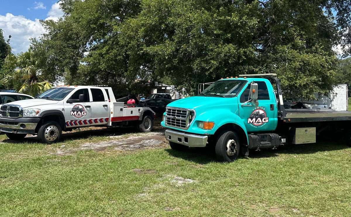 Flatbed tow truck at night