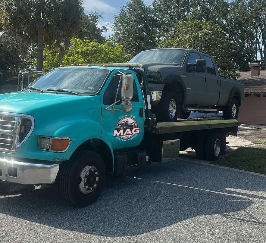 Preparing to load a vehicle onto the tow truck